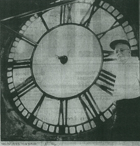 Carl Everingham behind the clock face.